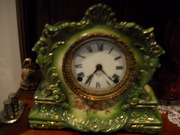 antique ansonia china clock,  porcelin face,  runs